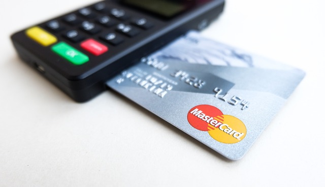 Photo of a card reader with a bank card inserted into it. 
